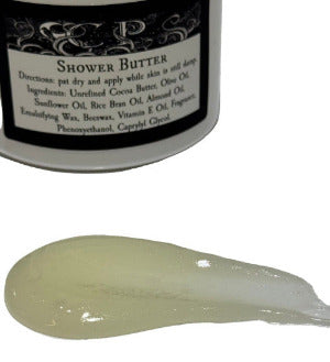 Shower butter with a label showing ingredients and directions on a white background with a smear of butter to show consistency 